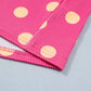 Pink twisted ribbed top with peach polka dots and patch pocket detail.