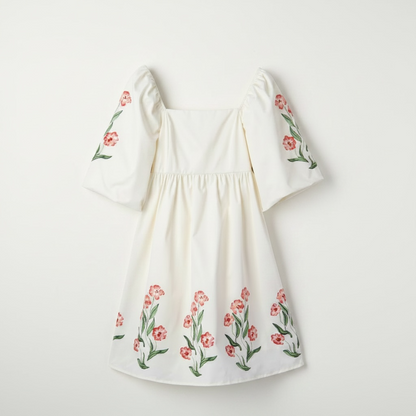 Beige floral print puff sleeve babydoll dress with pink flowers and green leaves.