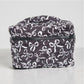 Black and white coquette bows quilted cosmetic bag with bow pattern and zip closure.