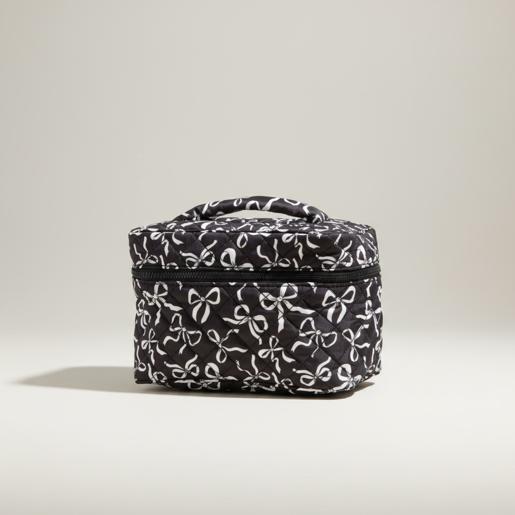 Black and white coquette bows quilted cosmetic bag with top zipper and handle