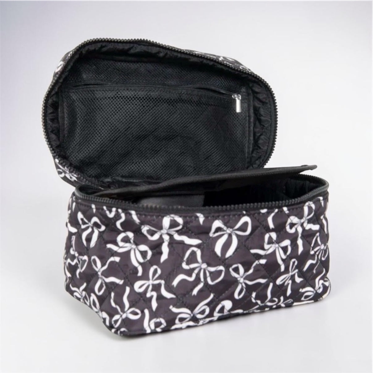 Black and white coquette bows quilted cosmetic bag with zip closure and inner mesh pocket