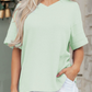 LemonDrop•LimePop mint green waffle knit V-neck short sleeve relaxed fit top with cuffed sleeves.