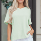 LemonDrop•LimePop mint green waffle knit v-neck short sleeve relaxed fit top with cuffed sleeves.