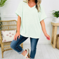LemonDrop•LimePop mint green waffle knit V-neck short sleeve relaxed fit top with cuffed sleeves.