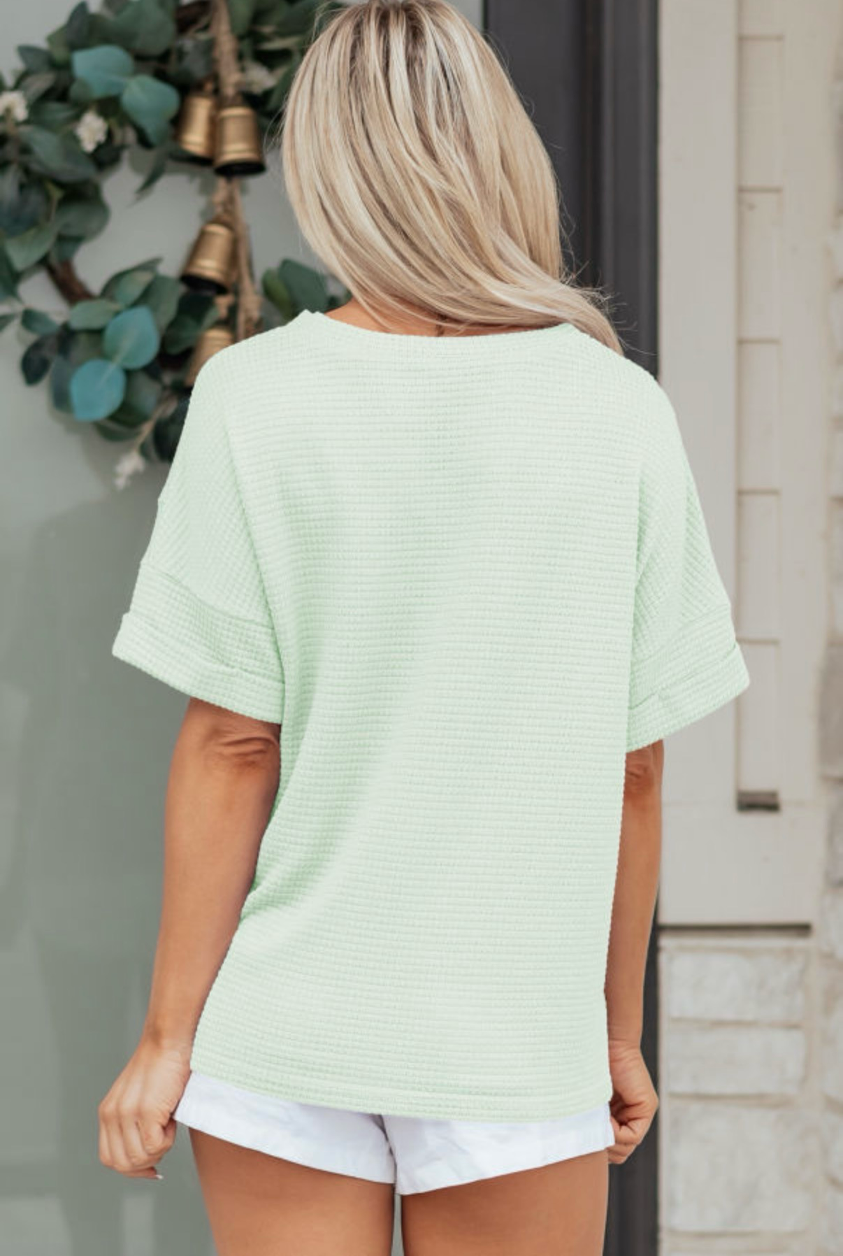LemonDrop•LimePop mint green waffle knit short sleeve V-neck top with cuffed sleeves.