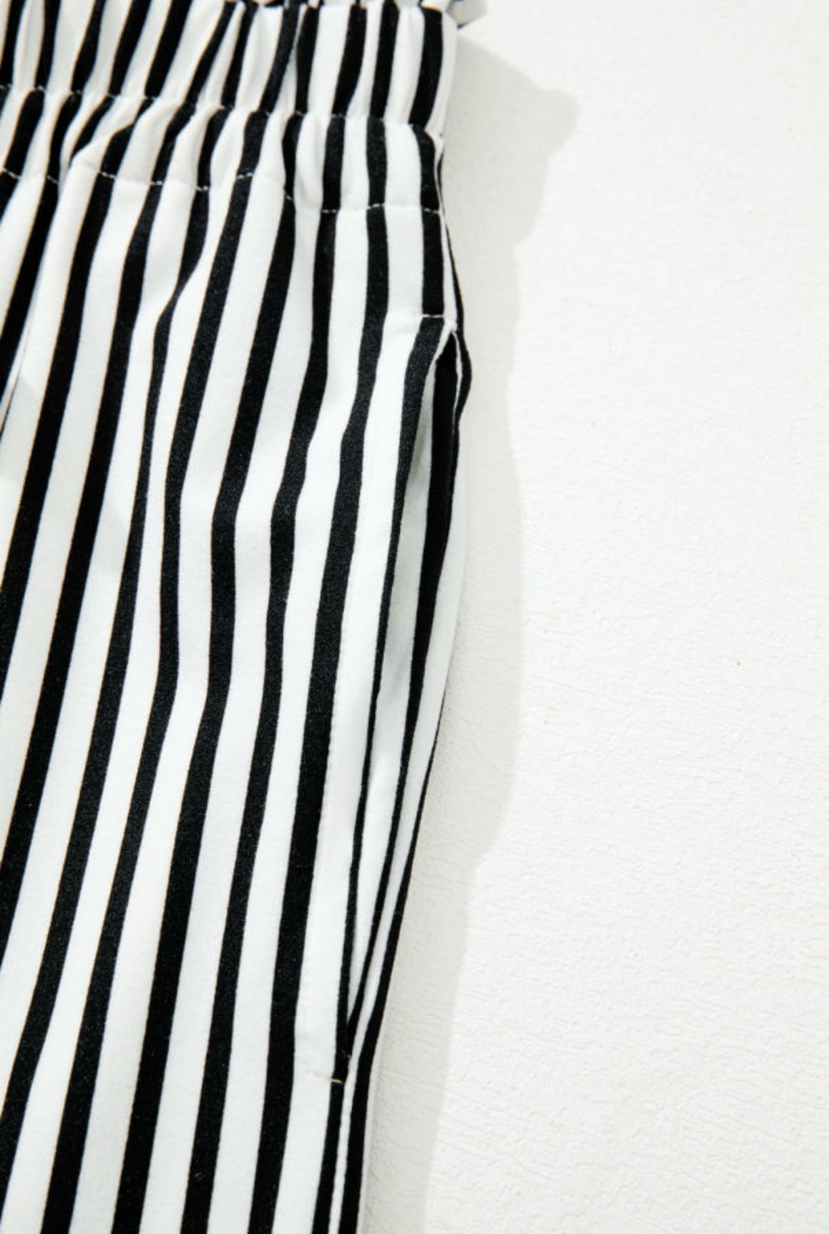 LemonDrop•LimePop black and white striped wide leg palazzo pants with tie waist and side pockets.