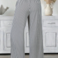 LemonDrop•LimePop black and white striped wide-leg palazzo pants with tie waist and elasticated waistband.
