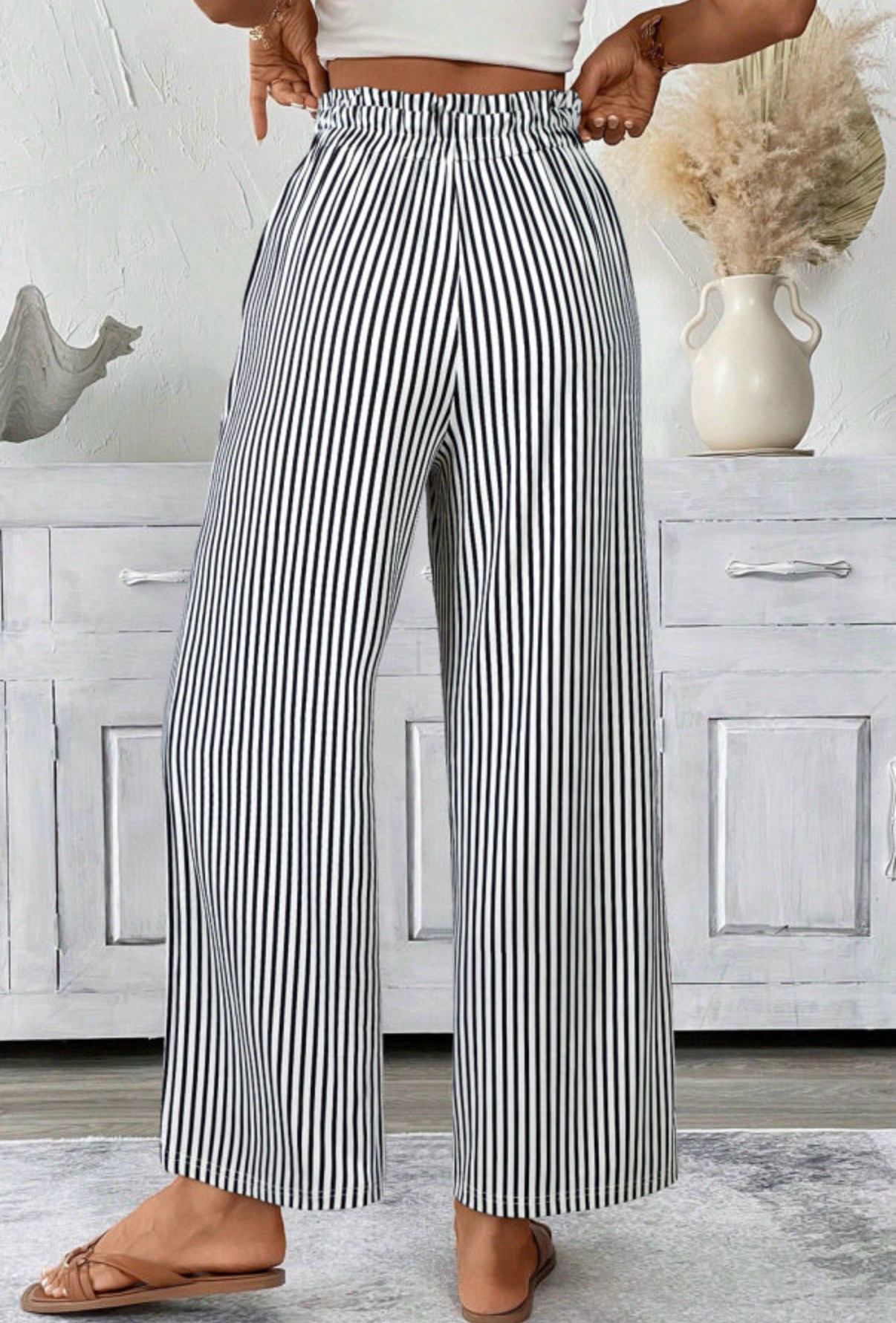 LemonDrop•LimePop black and white striped wide-leg palazzo pants with tie waist and elasticated waistband.