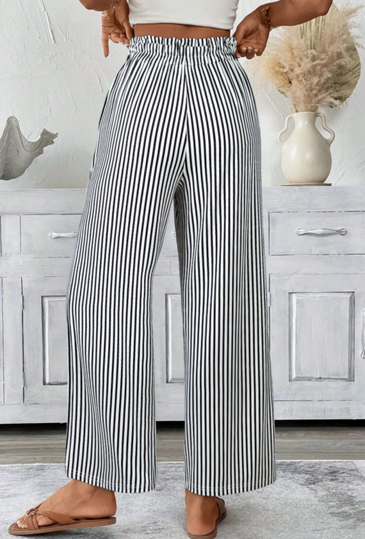 LemonDrop•LimePop black and white striped wide-leg palazzo pants with tie waist and elasticated waistband.