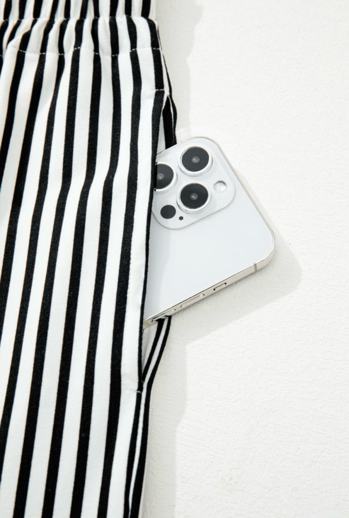 LemonDrop•LimePop black and white striped wide-leg palazzo pants with tie waist and side pockets.